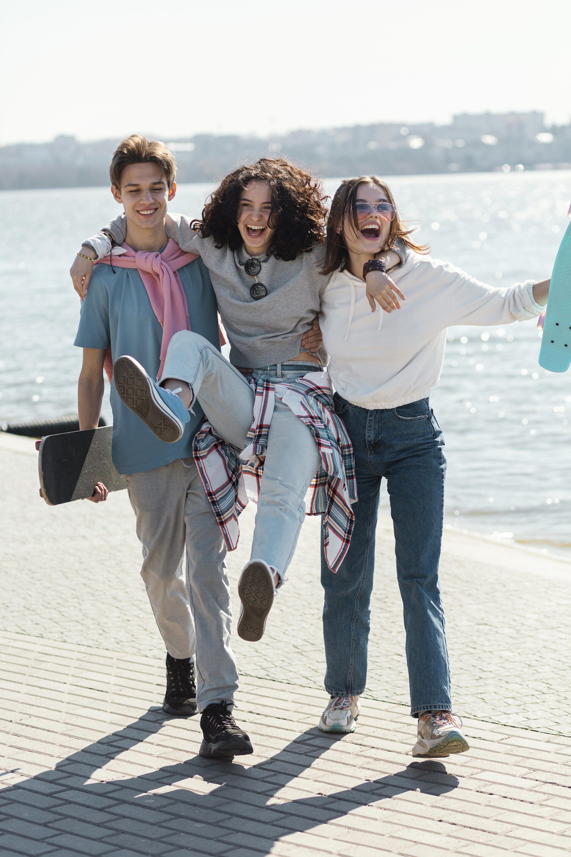 Diverse group of young friends smiling outdoors - exciting group adventure